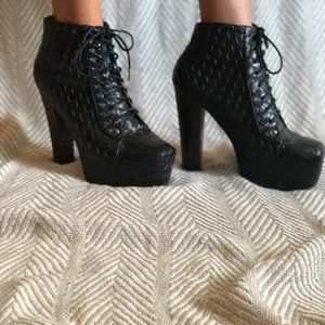 Thick heeled tie up boots